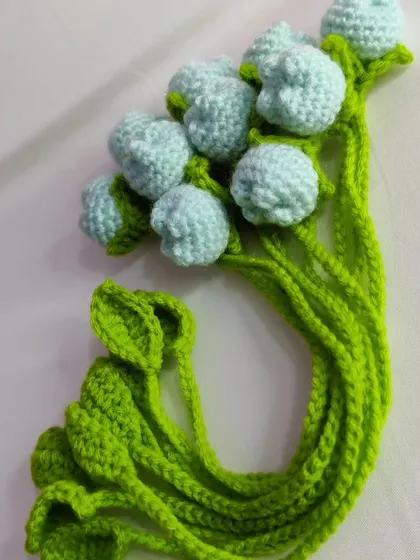 A bundle of light green tulip bookmarks.