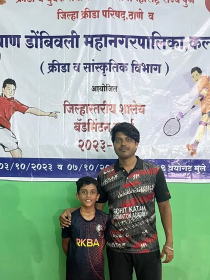 A coach and his student celebrating a third-place finish in the under-14 individuals at the KDMC DSO tournament.