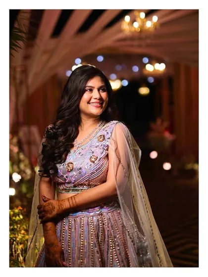 A stunning solo shot of the bride, looking radiant and happy on her Sangeet night. We make sure you feel like a star.