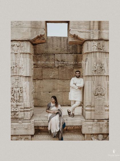 An artistic portrait of the couple within the stone pillars of a temple, creating a sense of timelessness and history.