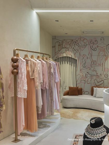 The full context of the boutique, where our mural complements the minimalist decor and high-end fashion.