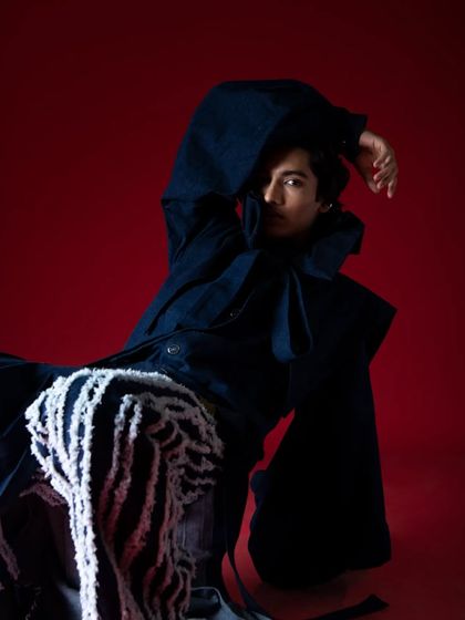 An artistic and expressive pose that plays with shadow and form.