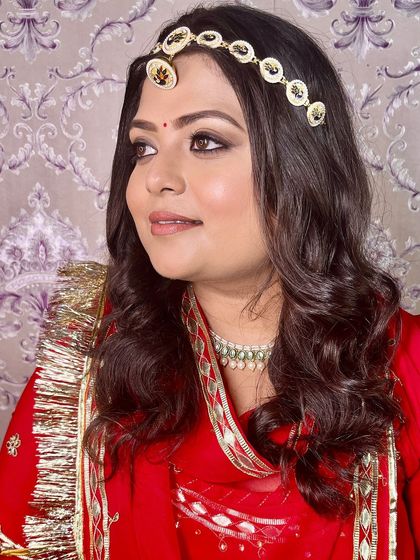 A traditional Rajasthani Haldi look. The makeup is kept classic and radiant, with a focus on glowing skin and defined eyes.