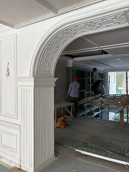 Work in progress at our Delhi site. Here, you can see the intricate plasterwork of an archway and fluted column being installed, a testament to the skilled craftsmanship that brings my designs to life.