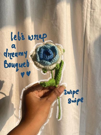"Let's wrap a dreamy bouquet." An annotated photo showing the start of the wrapping process for the blue and white roses.