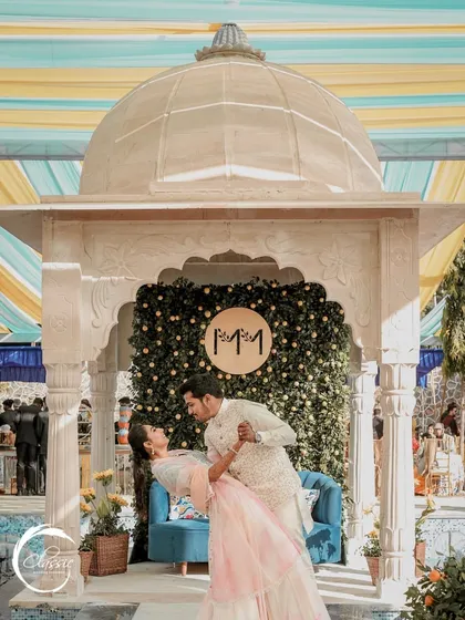 A joyful moment from a Rajasthani-themed Haldi. I created this setup with a marble-finish gazebo and a backdrop of greenery and lemons, providing a beautiful, picturesque spot for the couple's photos.
