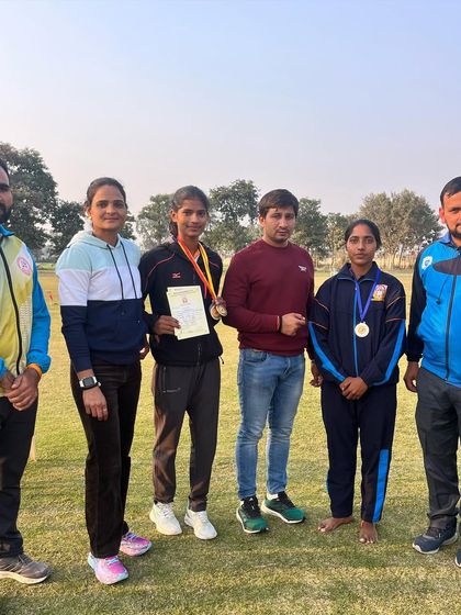 The coaching team with our winning athletes at the Chaudhary Charan Singh University athletics competition. Teamwork between coaches and athletes is key to our success.