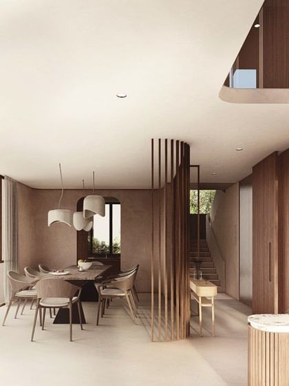 The upper floors of The Nest are designed as a vertical villa with a double-height courtyard at its heart. The interior uses a minimal material palette of wood and plaster to create an atmosphere of elegance, space, and warmth.