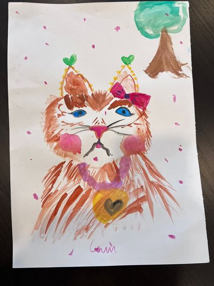 Another take on the "Slay Demon" kitty, this one adorned with a bow and a heart pendant, blending fierce with fancy.