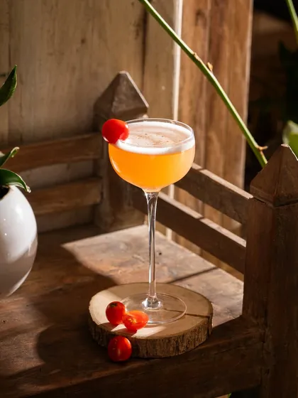 A simple, beautifully lit cocktail on a wooden surface. This shot proves that sometimes, less is more.