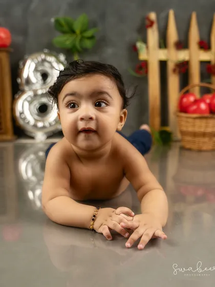 Tummy time. This 8-month milestone session captures the strength and curiosity of a baby exploring his surroundings.