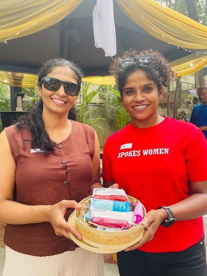 We love rewarding our community. A happy winner with her prize hamper at the Garage Sale.