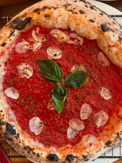 A crust-worthy Marinara pizza, fresh from the oven. The char on the crust is perfect.