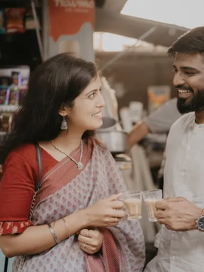 A happy, candid moment during the couple's chai break. The genuine smiles and easy conversation make this a warm and relatable portrait from their urban pre-wedding session.