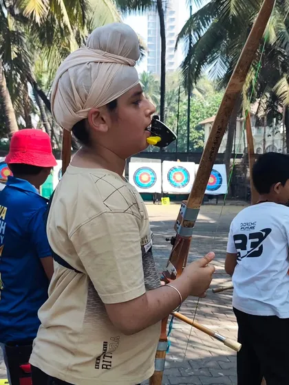 An archer waiting for his turn to shoot at the U-13 trials. Patience is a virtue that every archer learns to master.
