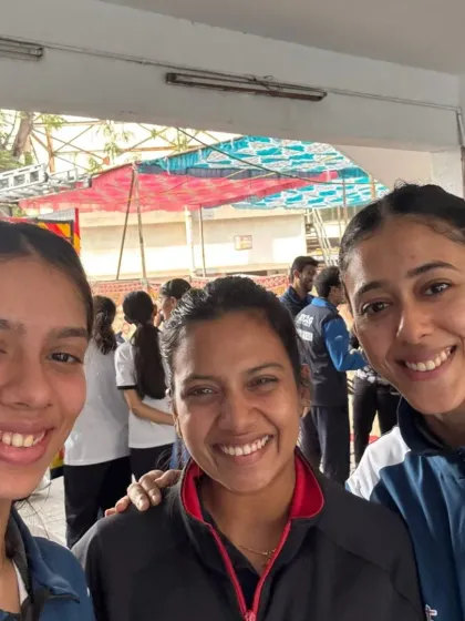 A candid moment between our senior players at the National Championships. The support and camaraderie within our team are just as important as the training.