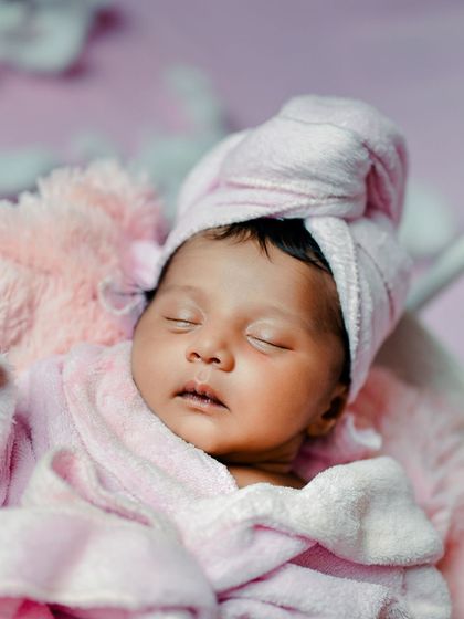 A close-up of the newborn spa theme, focusing on the baby's serene expression.