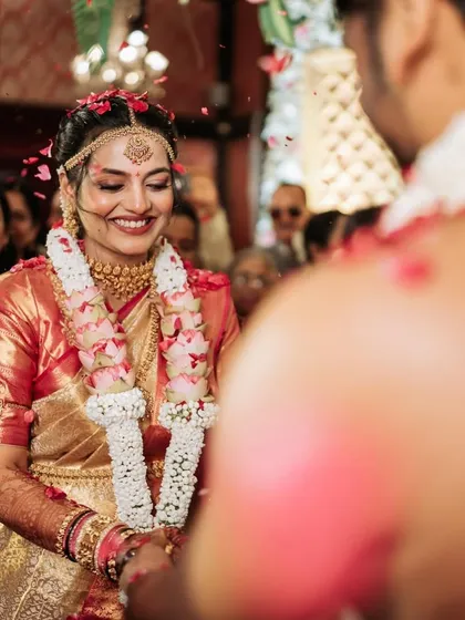 A candid moment from the wedding ceremony, with the bride's joyful expression captured perfectly.