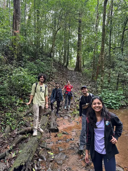 A group of friends trekking through the dense forest of Kumara Parvatha.