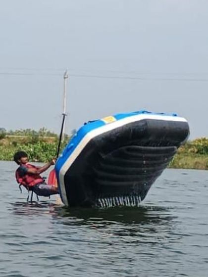 A participant practices a solo raft-flipping technique, an advanced skill taught in our specialized courses.