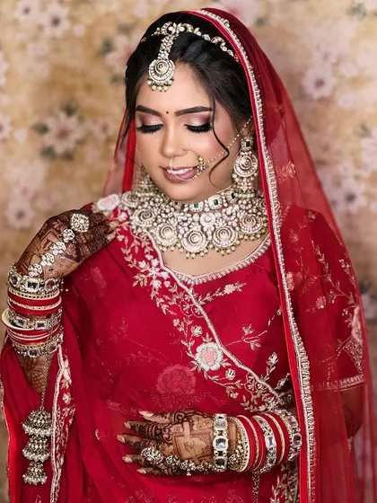 A candid, happy moment, capturing the bride's smile and the way the jewellery completes her joyful expression.