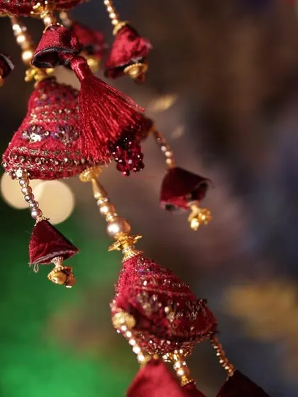 A detailed close-up of the bride's kalire, an important and beautiful part of the Punjabi wedding tradition.