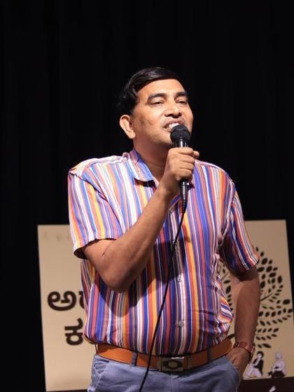 A seasoned performer entertains the crowd with his unique style.