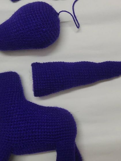 The making of a dragon. Here are the separate crochet pieces before they are assembled. This behind-the-scenes look shows how much work goes into each amigurumi toy.