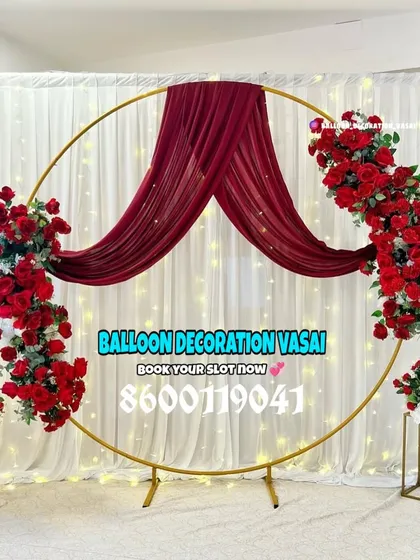 For a bold and passionate theme, I used a golden ring frame draped with rich red fabric and decorated with matching red rose arrangements. This engagement backdrop is dramatic and perfect for making a statement.