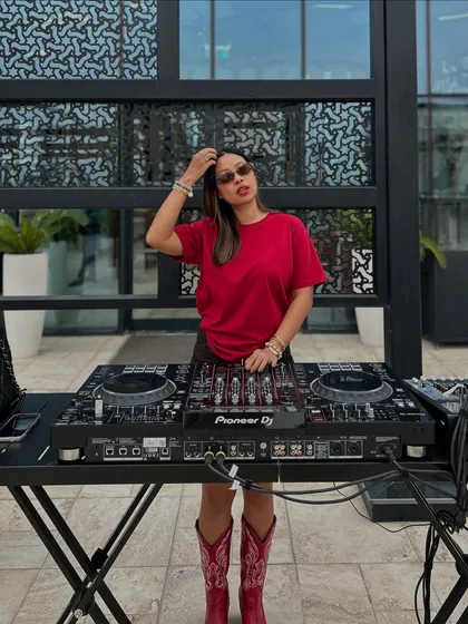 A full view of my setup and style during an international gig. I teach not just the technical skills, but also how to build your own brand and presence as a DJ.