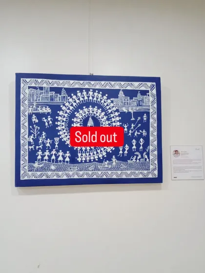 A closer look at the sold Warli masterpiece. The white figures on the deep blue background create a striking contrast, telling a story of celebration and togetherness.