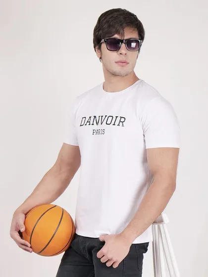 A standing shot with a basketball prop adds a sporty, lifestyle element to this men's t-shirt photography.