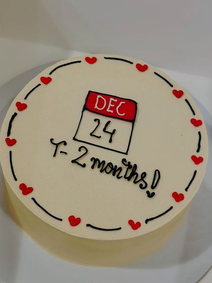 A sweet bento cake with a calendar marking a special date. It's a creative way to celebrate an anniversary or countdown to a big day.