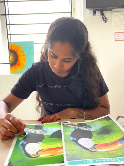 Another student from our CFA course practices her soft pastel techniques. We use reference images and guided instruction to help students master challenging mediums and create vibrant, detailed artwork.