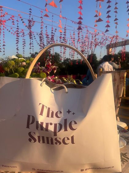My signature "The Purple Sunset" bag spotted at a beautiful outdoor wedding event. I love seeing my creations become a part of my clients' celebrations.
