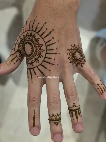 Mehndi isn't just for women. I create minimalist and modern henna tattoos for men, like this sun-inspired mandala design that is both stylish and masculine.