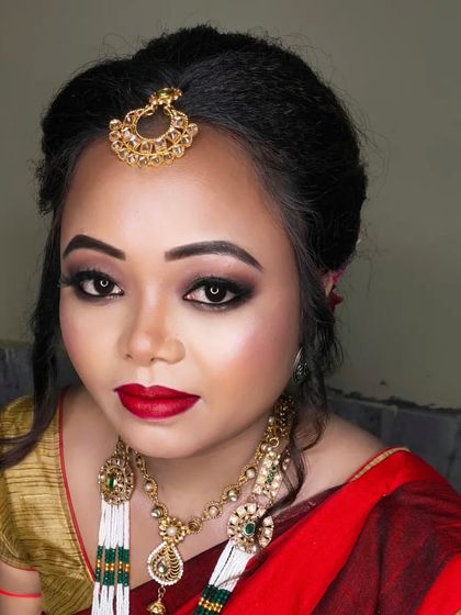 A full-face portrait of the Assamese bride, looking absolutely stunning and ready for her big day.