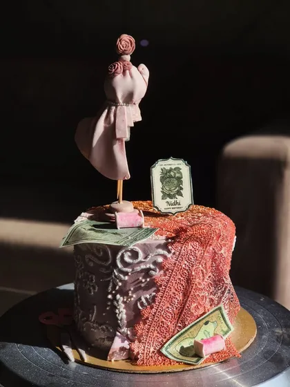 I absolutely love a creative challenge. This custom cake was for a fashion student, complete with an edible mannequin, fabric-like draping, and other design elements. If you have a unique theme in mind, I'm here to bring it to life.