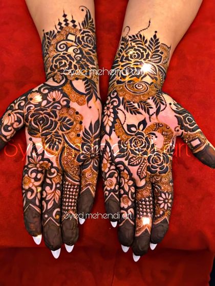 A stylish design with pointed nails, showcasing a mix of florals and modern patterns.