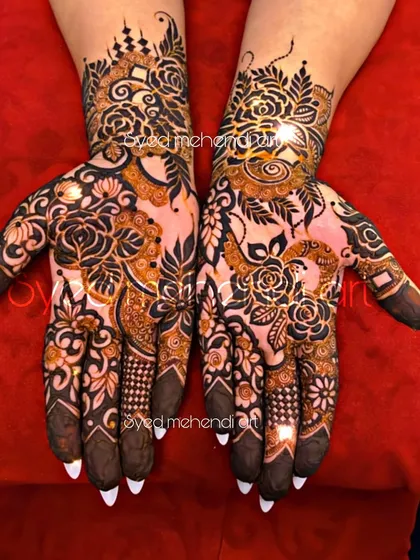 A stylish design with pointed nails, showcasing a mix of florals and modern patterns.