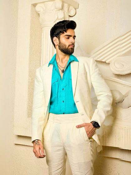 A full-length view of the off-white suit, showcasing its relaxed yet sophisticated silhouette. It’s a versatile piece for any man who wants to look effortlessly stylish.