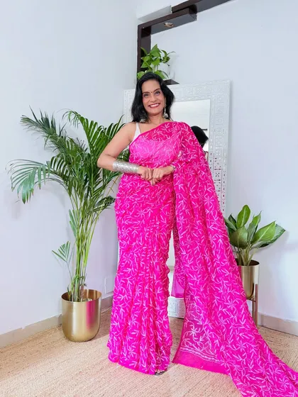 This vibrant pink Chikankari saree is a showstopper. The color is bold and beautiful, and the georgette fabric drapes wonderfully.