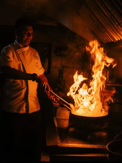 Fueled by fire, finished with finesse. A glimpse into our kitchen where the real magic happens, as our chef brings a dish to life with the dramatic flare of a wok. This is the passion and energy we bring to every event.
