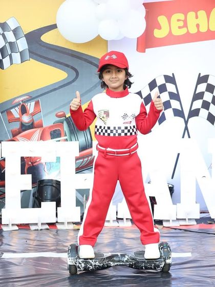 The birthday boy, Jehan, looking like a professional racer on his hoverboard in front of the main stage. His outfit perfectly matched the theme!