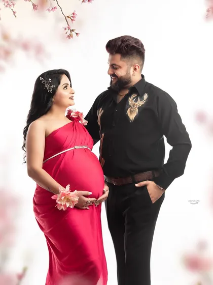 A classic studio couple portrait is a wonderful way to celebrate your journey together. Here, the focus is on the connection between the parents-to-be in a bright, clean setting that feels both modern and timeless.