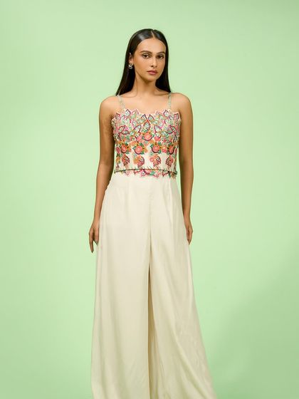 This extensive collection features a wide array of modern festive attire. From vibrant sharara sets and elegant anarkalis to chic jumpsuits and light lehengas, these pieces are curated for wedding guests and anyone looking for a stylish outfit for a special occasion.