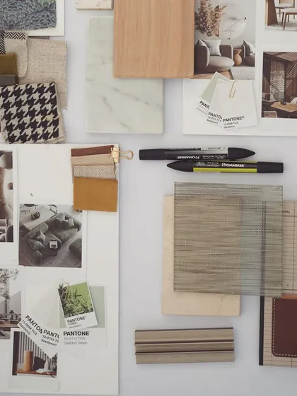 This image captures the paraphernalia that goes into designing a space. A moodboard is a physical representation of our creative process, filled with textures, colors, and inspirational images.