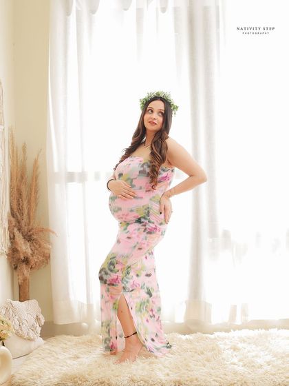A beautiful solo portrait with a floral crown in our bright and airy lifestyle corner. The floral dress and natural light create a fresh, bohemian feel.