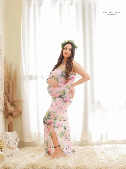 A beautiful solo portrait with a floral crown in our bright and airy lifestyle corner. The floral dress and natural light create a fresh, bohemian feel.