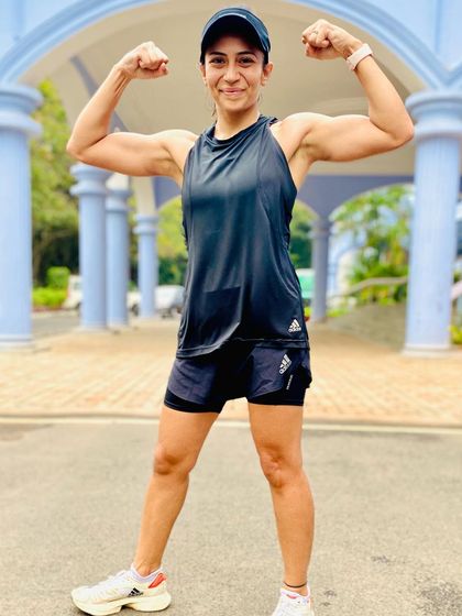 Flexing with pride. This photo captures my strength and determination, qualities that I've built through years of consistent training and hard work.